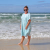 Adult wearing Aqua Lagoon sand-free beach hoodie showing comfort and style.