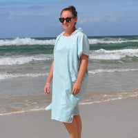 Adult wearing Aqua Lagoon sand-free beach hoodie showing comfort and style.