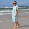 Adult wearing Aqua Lagoon sand-free beach hoodie showing comfort and style.
