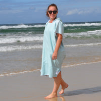 Adult wearing Aqua Lagoon sand-free beach hoodie showing comfort and style.