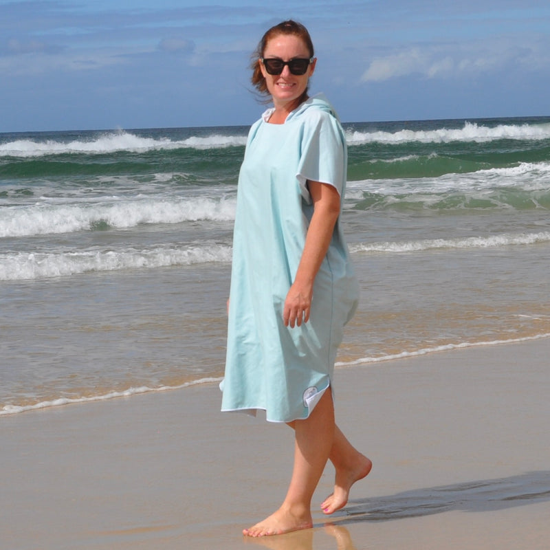 Adult wearing Aqua Lagoon sand-free beach hoodie showing comfort and style.