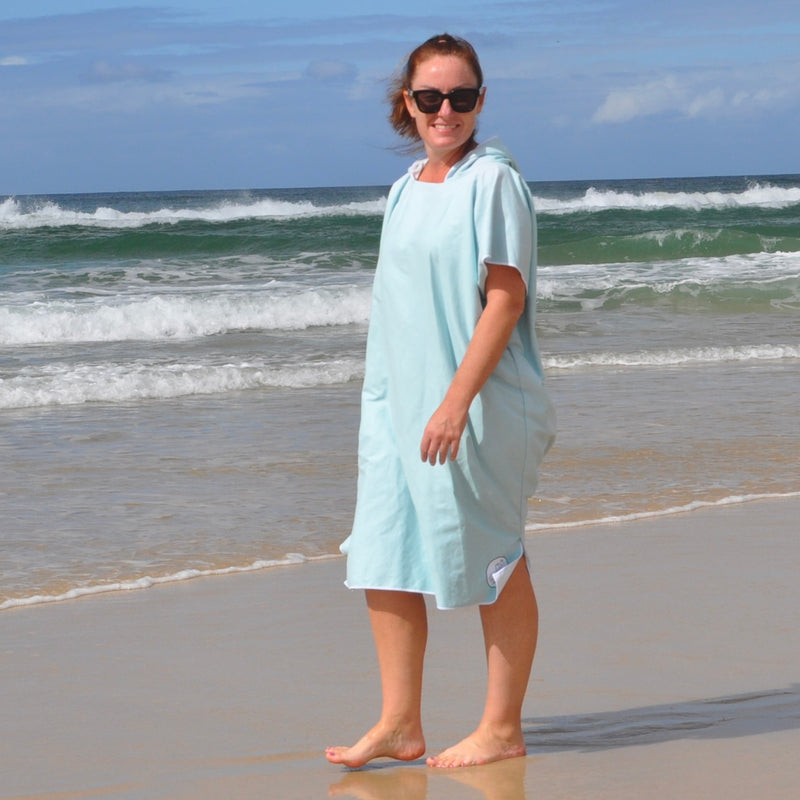 Adult wearing Aqua Lagoon sand-free beach hoodie showing comfort and style.