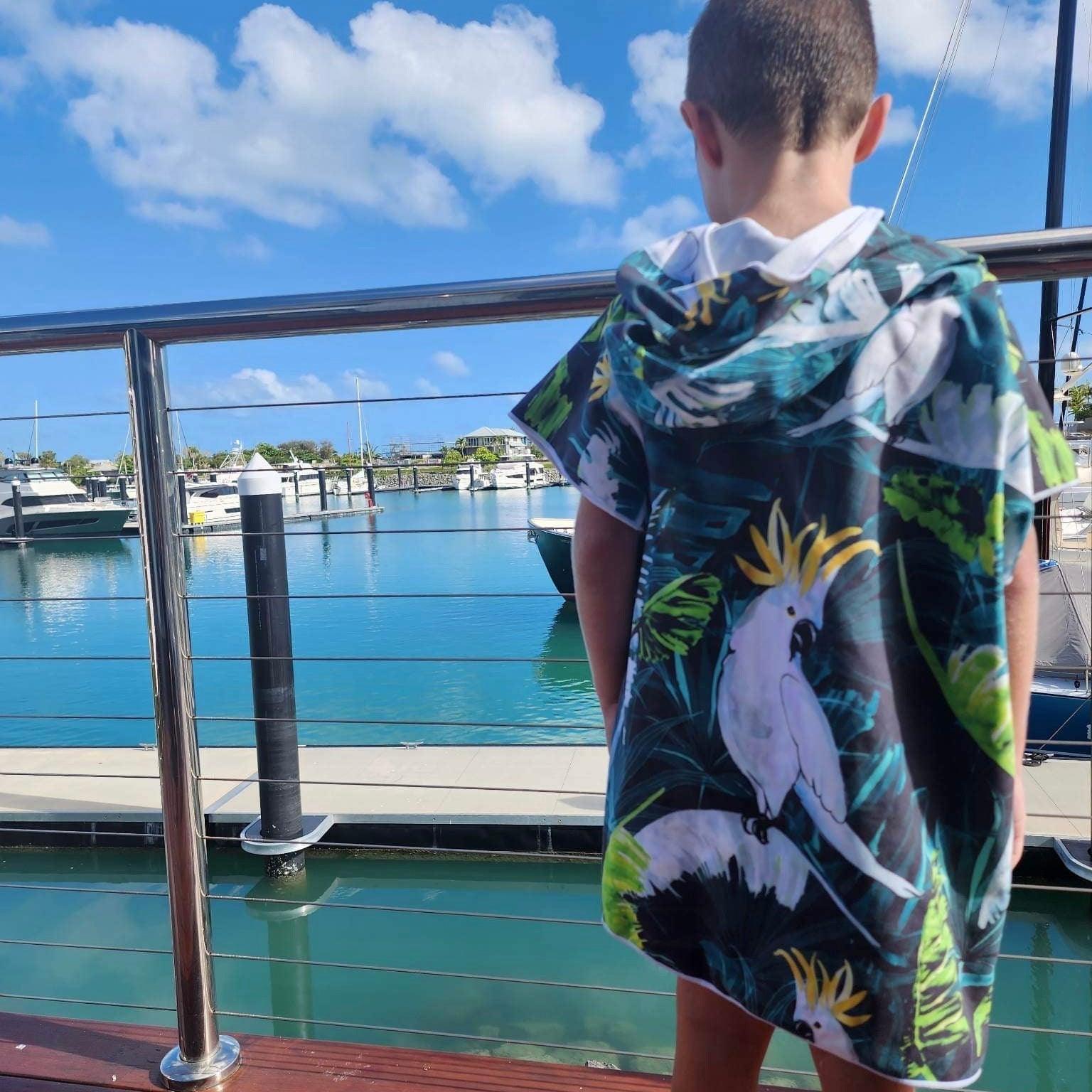 Bird of Paradise - Sand-Free Beach Hoodie - Sandi Toes looking over the boats at Hamilton Island