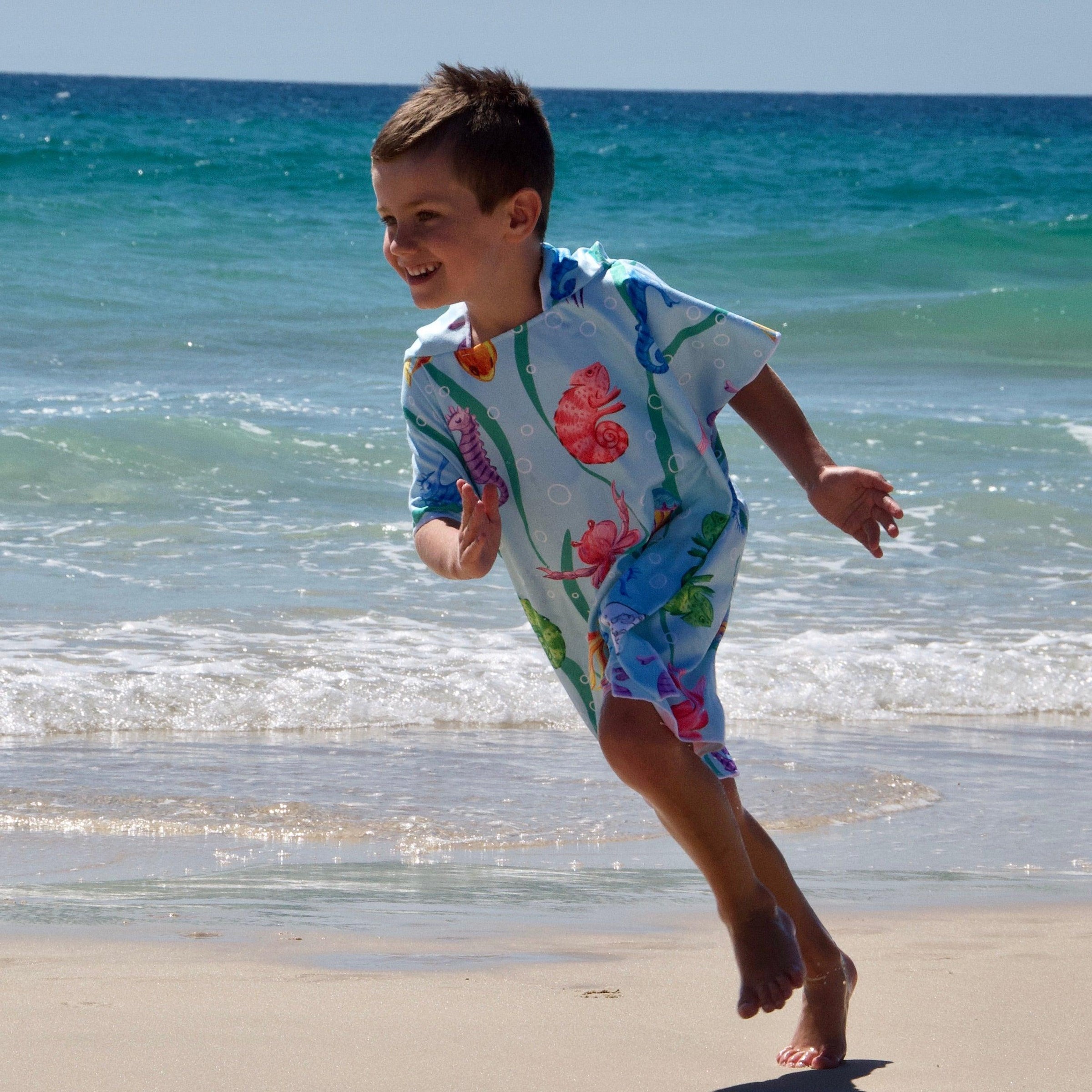 Earth and Sea - Sand-Free Beach Hoodie - Sandi Toes running on the beach