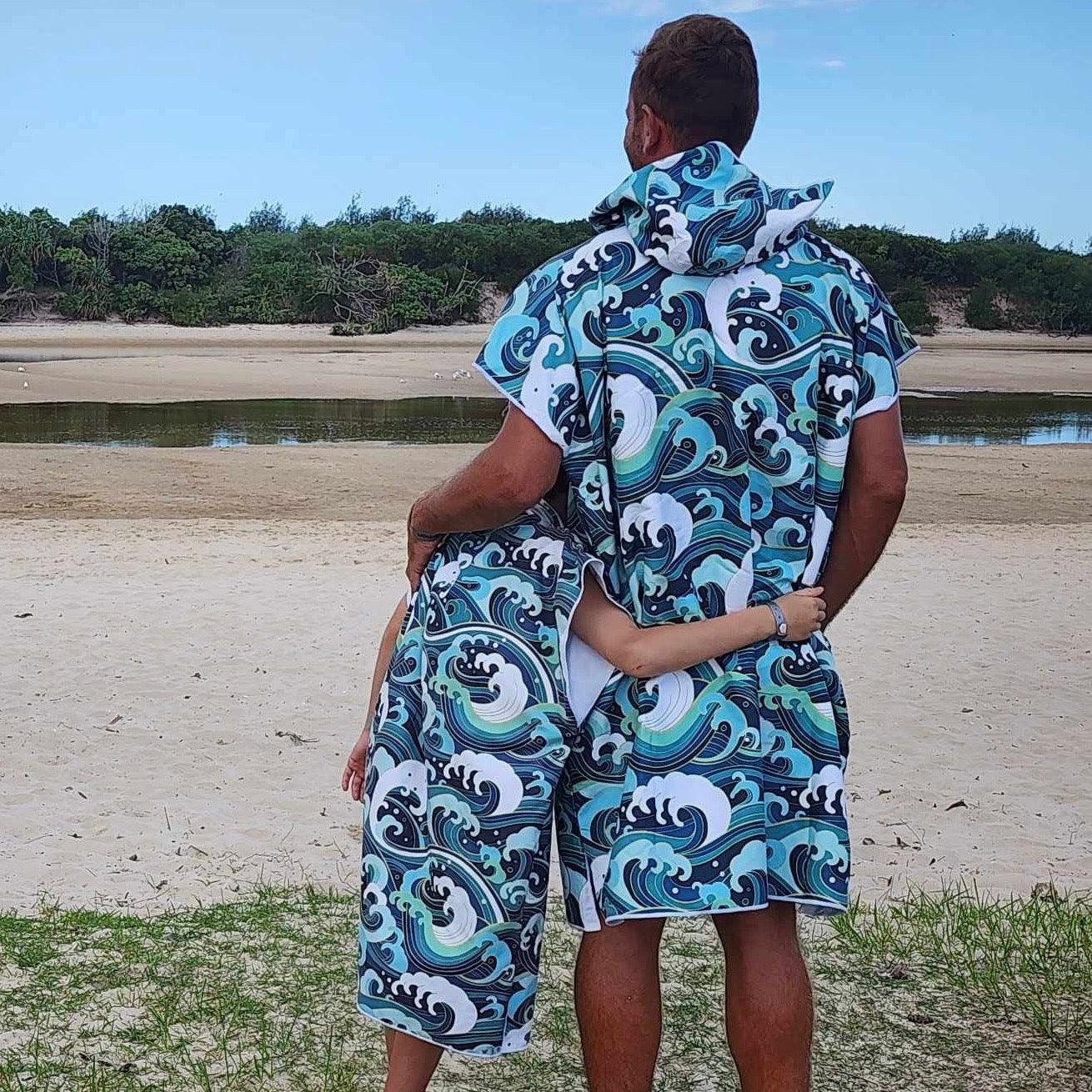 Father and Son wearing Wipeout sand-free beach hoodie showing comfort and style.
