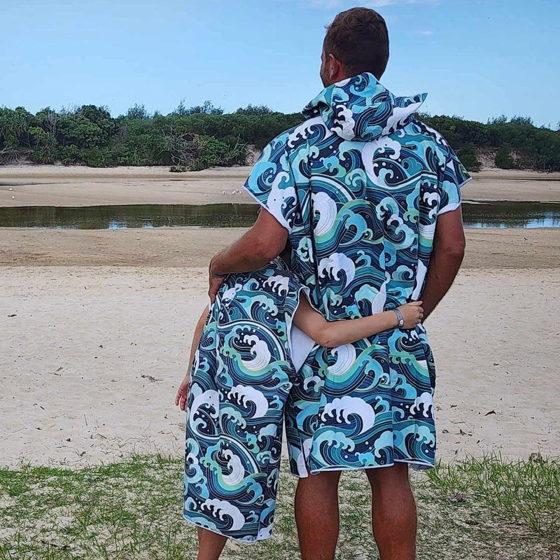 Father and Son wearing Wipeout sand-free beach hoodie showing comfort and style.