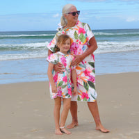 "Island Princess sand-free hoodie - Grand Mother and grand daughter wearing matching adult and kids hoodies in happy mood on beach"