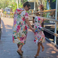 Island Princess - Sand-Free Beach Hoodie - Sandi Toes mother and daughter in a spritely mood at a resort