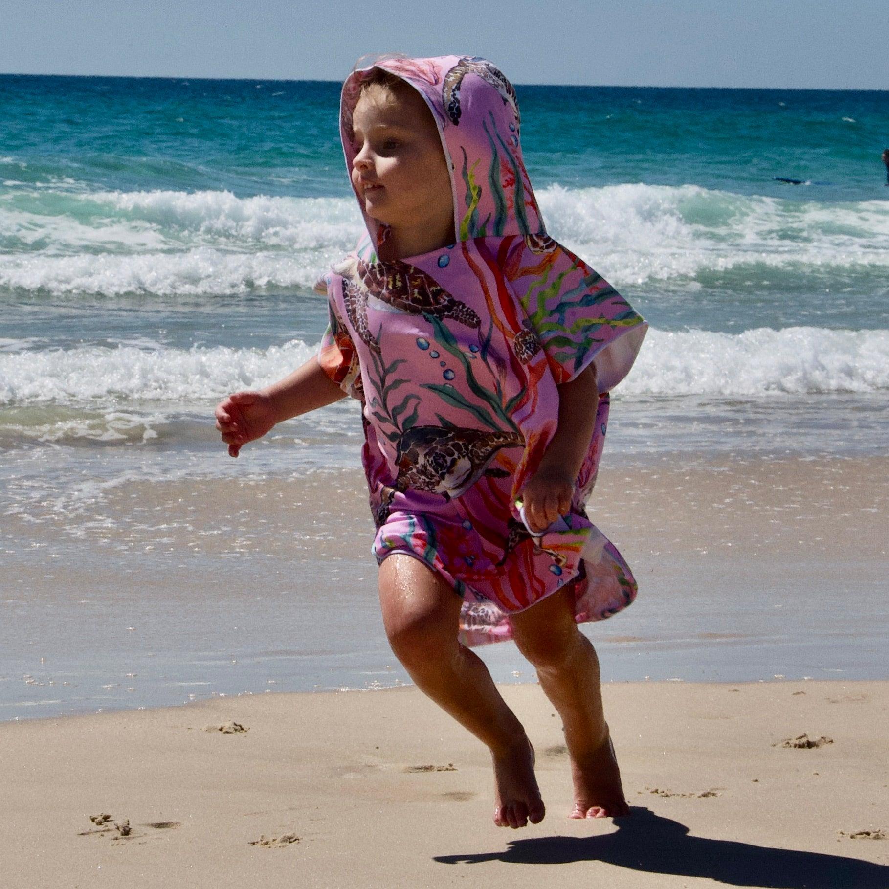 Turtle Cove - Sand-Free Beach Hoodie - Sandi Toes, running on the beach in a small
