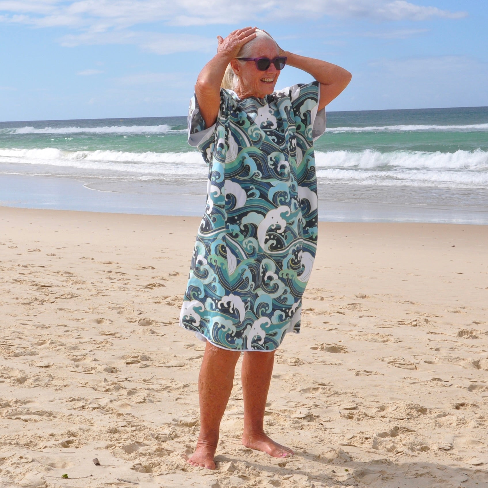 Adult wearing Wipeout sand-free beach hoodie showing comfort and style.