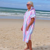 Adult wearing Xalli sand-free beach hoodie showing comfort and style